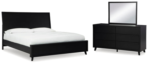 Ashley Furniture Danziar bedroom set featuring a bed frame, matching nightstands, and dresser in a modern design.