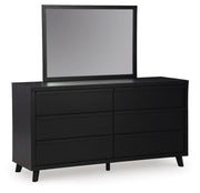 Ashley Furniture Danziar dresser with matching mirror, featuring a modern wood finish and sleek design, shown from an angled side view.