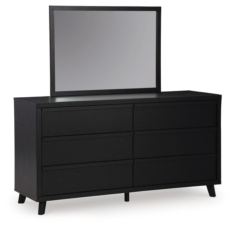 Ashley Furniture Danziar dresser with matching mirror, featuring a modern wood finish and sleek design, shown from an angled side view.