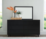 Ashley Furniture Danziar bedroom set with modern bed frame, matching nightstands, and dresser in a stylish bedroom layout.