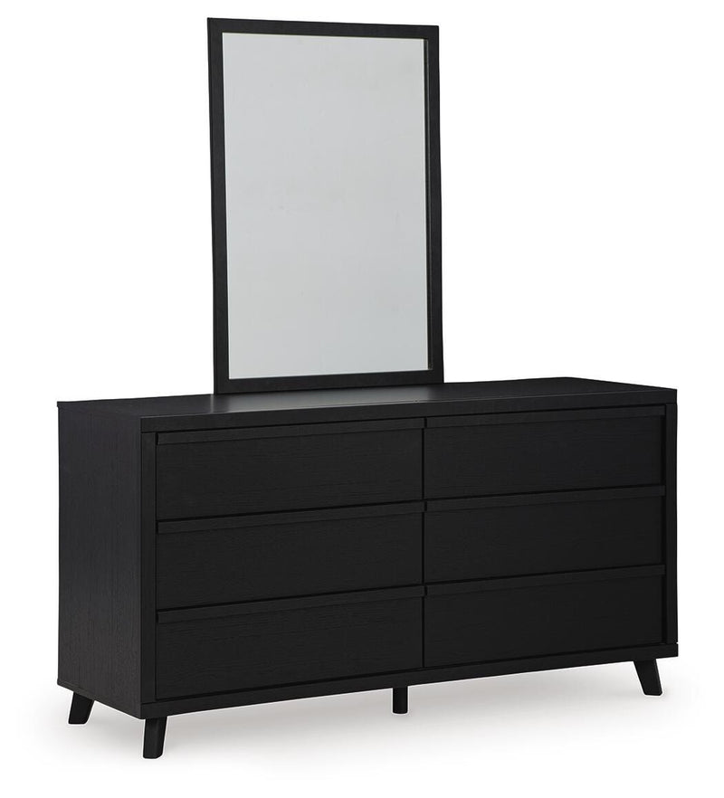 Ashley Furniture Danziar dresser with mirror, featuring a sleek wooden finish and modern design, shown from an angled side view.
