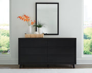 Ashley Furniture Danziar bedroom set with a modern bed frame, nightstands, and dresser in a stylish bedroom setup.