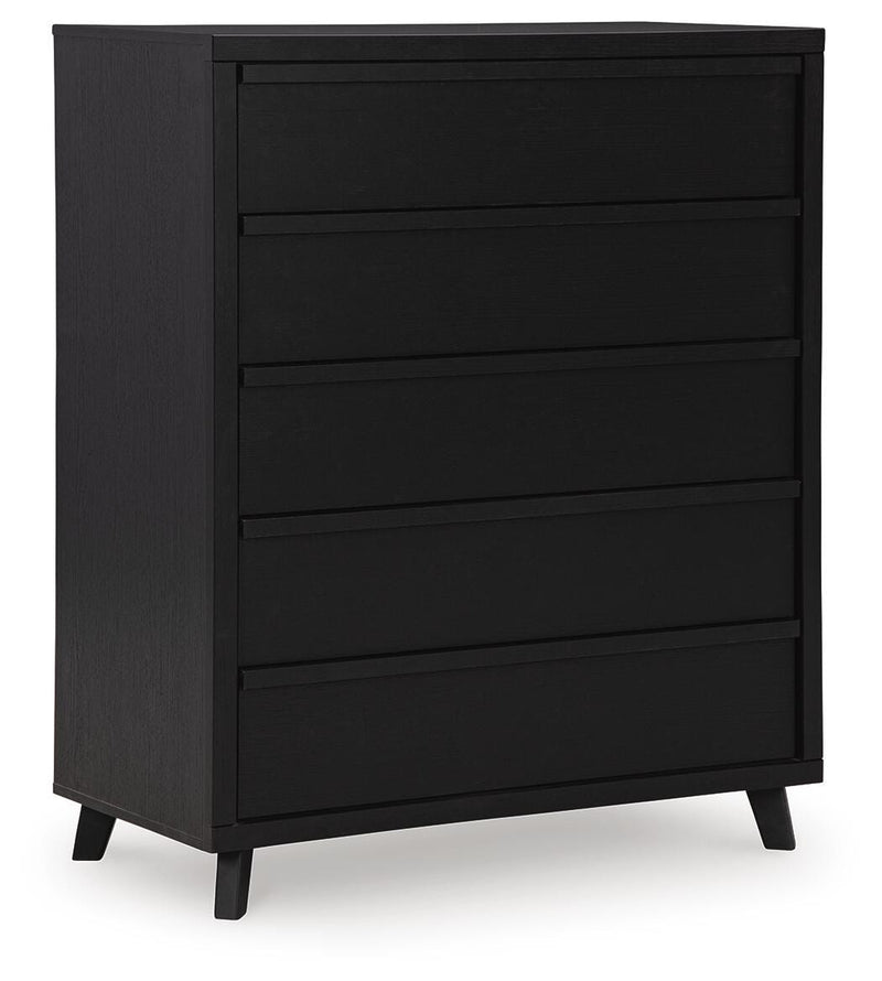 Ashley Furniture Danziar wide chest of drawers with multiple drawers, dark wood finish, angled view, closed drawers, stylish and spacious storage