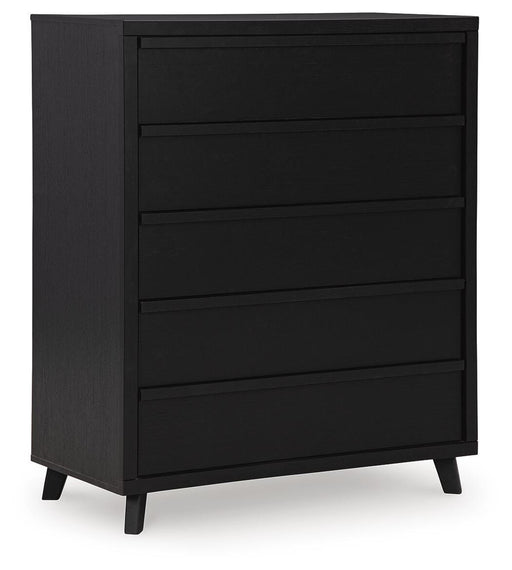 Ashley Furniture Danziar wide chest of drawers with multiple drawers, dark wood finish, angled view, closed drawers, stylish and spacious storage