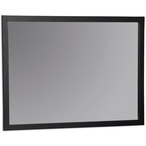 Ashley Furniture Danziar bedroom mirror with a sleek, modern design shown from an angled side view.