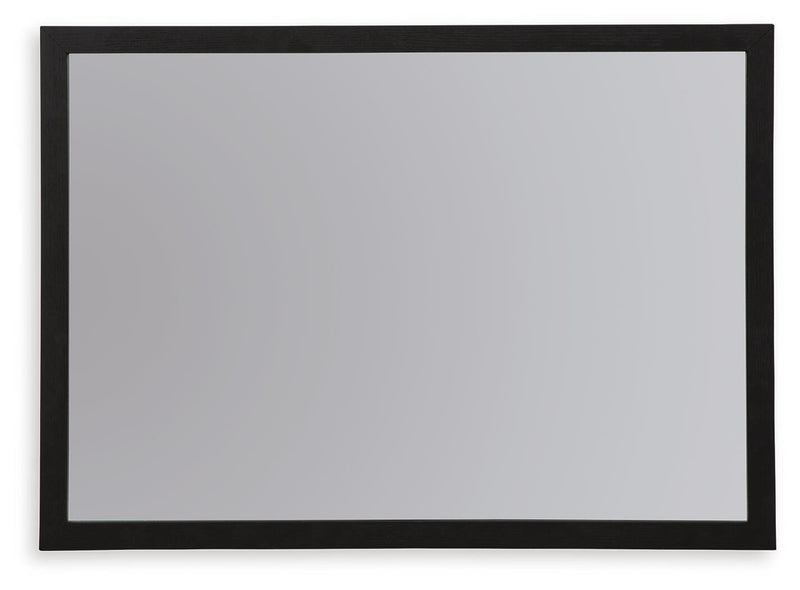 Ashley Furniture Danziar bedroom mirror with a sleek rectangular frame, mounted on a wall, showcasing modern bedroom decor.