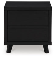 Ashley Furniture Danziar Bedroom Set with a modern bed frame and matching nightstands, showcasing a sleek bedroom furniture design.