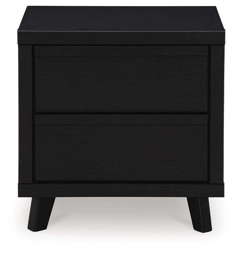 Ashley Furniture Danziar Bedroom Set with a modern bed frame and matching nightstands, showcasing a sleek bedroom furniture design.