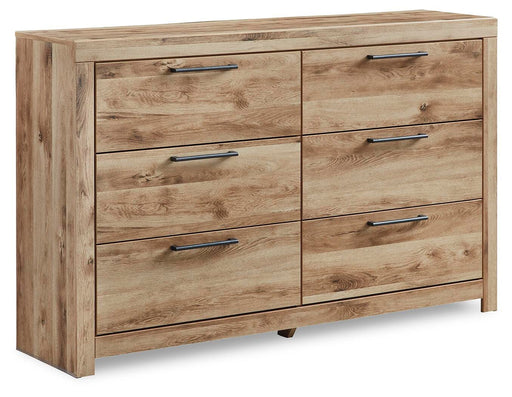 Ashley Furniture Hyanna Dresser with closed drawers, wooden finish, and modern design, shown from an angled perspective.