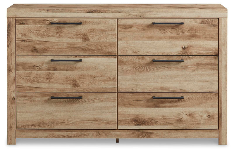 Ashley Furniture Hyanna dresser with a sleek wood finish and modern design, featuring multiple drawers for bedroom storage.