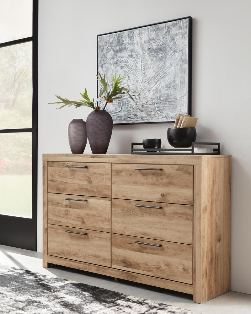 Ashley Furniture Hyanna dresser and mirror set, featuring a sleek wooden dresser with a matching mirror for bedroom storage and style.