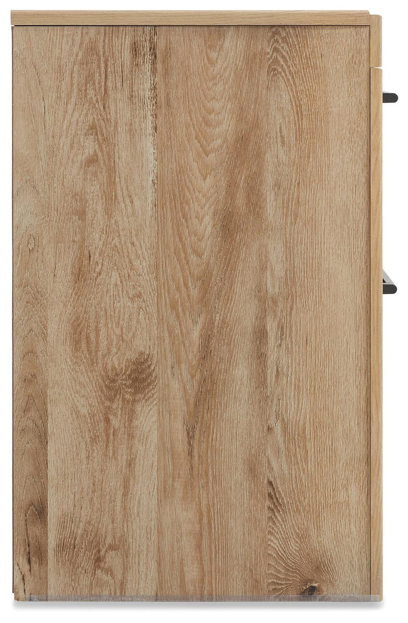 Ashley Furniture Hyanna nightstand with a sleek wooden finish and modern design, featuring a drawer and open shelf for bedroom storage.