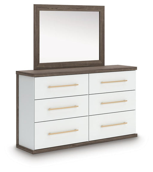 Ashley Furniture Kendanport dresser with matching mirror, featuring a modern wooden design and sleek hardware.