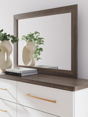 Ashley Furniture Kendanport dresser with matching mirror, featuring sleek wood finish and modern design details.