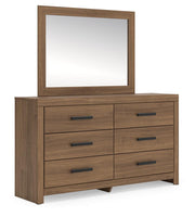 Ashley Furniture Broachmyn dresser and mirror set with a wooden dresser and matching mirror, angled view showcasing the detailed design.