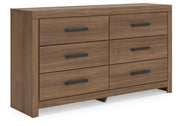 Ashley Furniture Broachmyn dresser and mirror set, showing a stylish wooden dresser with an attached mirror from an angled side view.