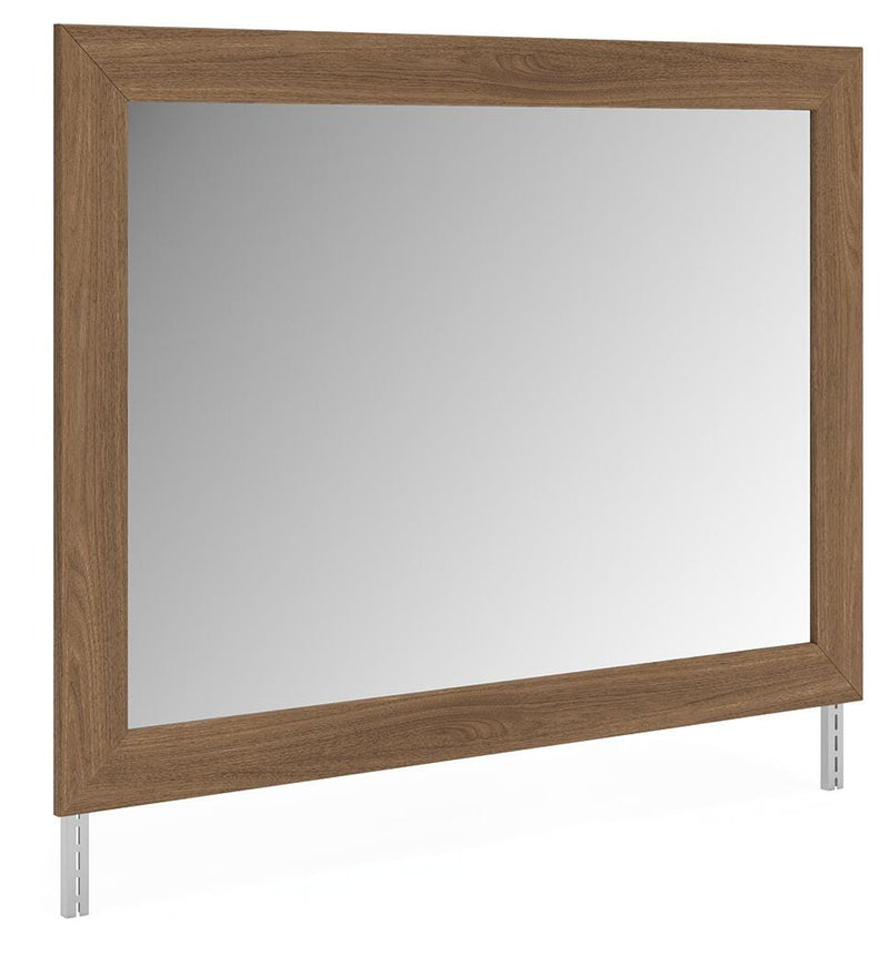 Ashley Furniture Broachmyn dresser with matching mirror, showcasing a modern wood finish and sleek design in an angled view