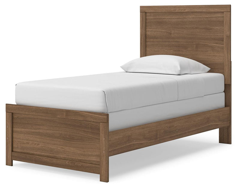 Ashley Furniture Broachmyn Bed with a wooden frame and detailed headboard, shown from an angled view.