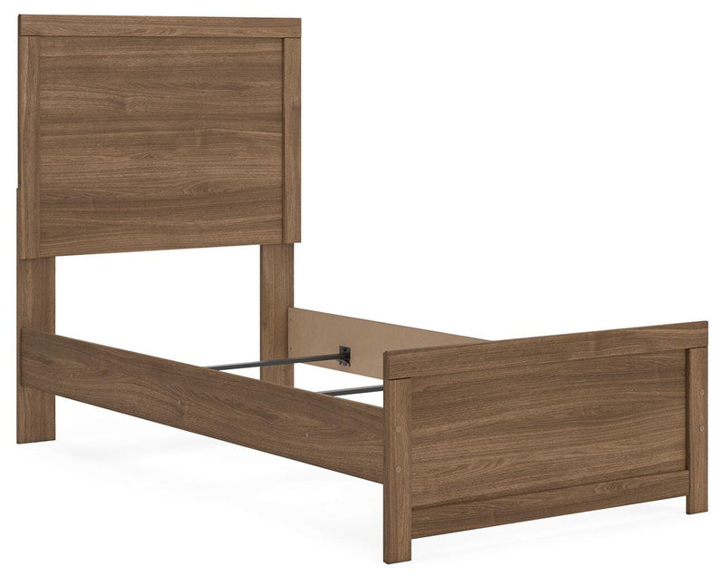 Ashley Furniture Broachmyn Bed with a stylish headboard and frame in a modern bedroom setting.