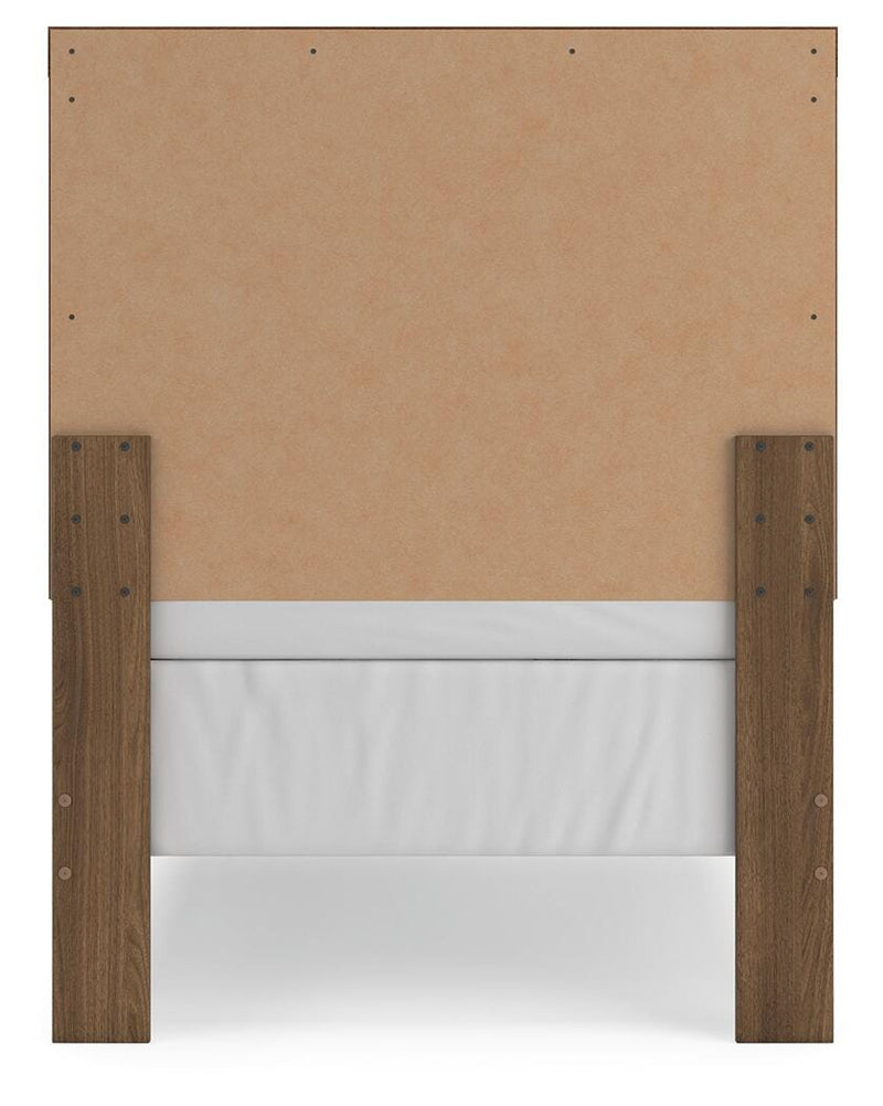 Ashley Furniture Broachmyn Bed with a sleek wooden frame and headboard, shown in a modern bedroom setting.