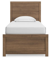 Ashley Furniture Broachmyn Bed with a headboard featuring intricate wood detailing and a classic design.