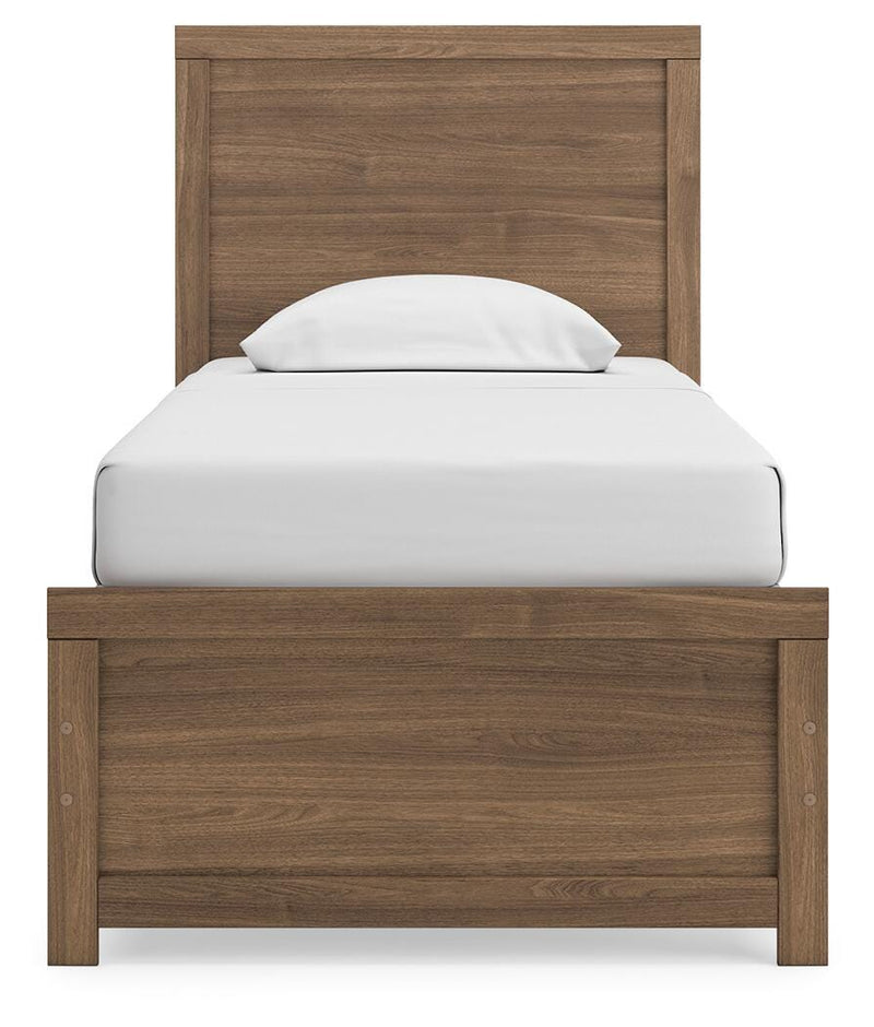 Ashley Furniture Broachmyn Bed with a headboard featuring intricate wood detailing and a classic design.