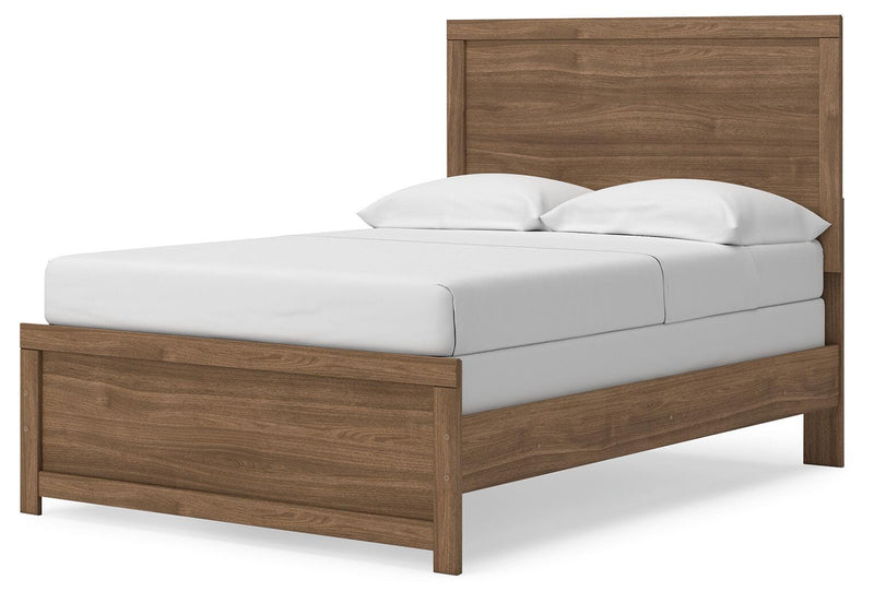 Ashley Furniture Broachmyn Bed with a wooden frame and elegant headboard, shown from an angled side view.