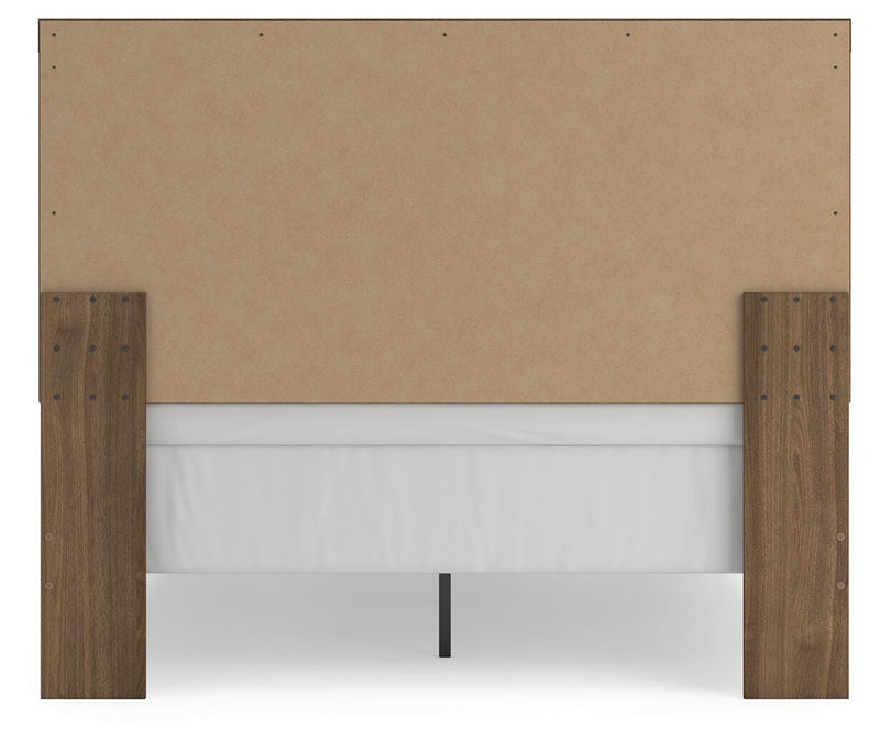 Ashley Furniture Broachmyn Bed with upholstered headboard and dark wood finish, shown from the back with detailed fabric and wood frame.