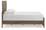 Ashley Furniture Broachmyn Bed with a wooden frame, headboard, and side view showing the elegant design and finish.