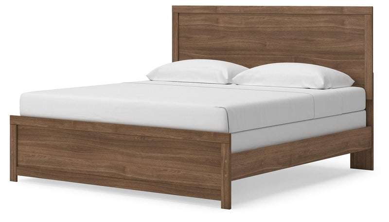Ashley Furniture Broachmyn Bed with a stylish headboard and wooden frame, shown from an angled side view.