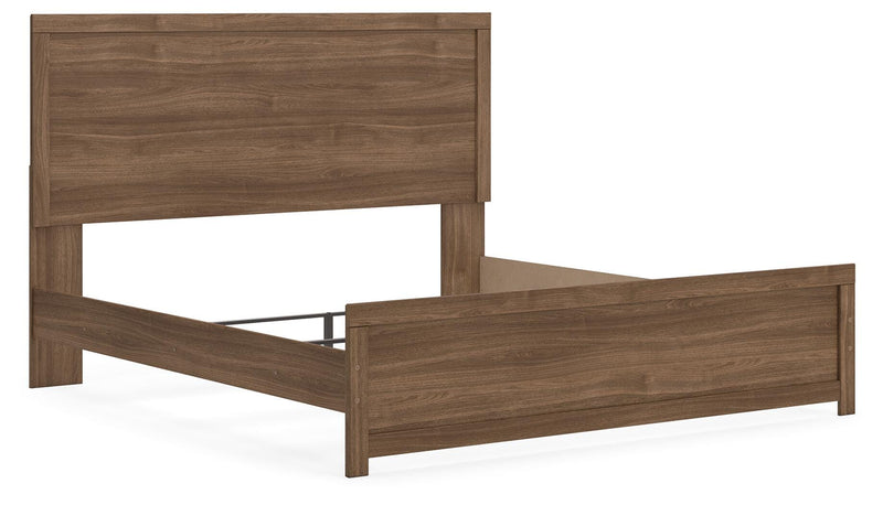 Ashley Furniture Broachmyn Bed shown from an angled view, featuring a sturdy wooden frame and detailed headboard design.