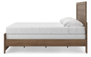 Ashley Furniture Broachmyn Bed in dark wood finish, showcasing the elegant headboard and sturdy frame in a bedroom setting.