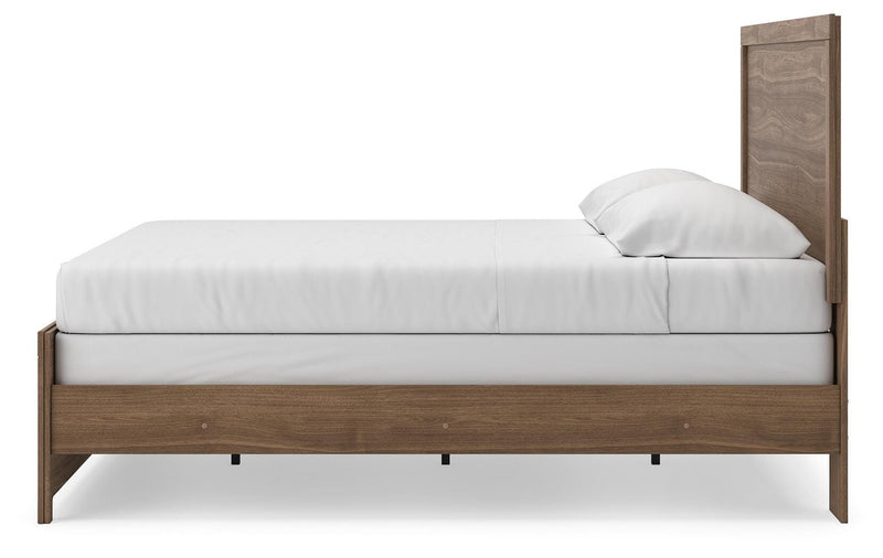 Ashley Furniture Broachmyn Bed in dark wood finish, showcasing the elegant headboard and sturdy frame in a bedroom setting.