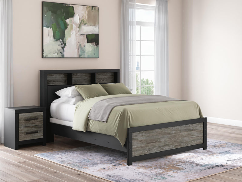 Ashley Furniture Broachmyn Bed with detailed wood frame and upholstery, showcasing a stylish bedroom centerpiece.