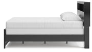 Ashley Furniture Broachmyn Bed with a close-up view of the side panel showcasing the wood finish and detailed design.