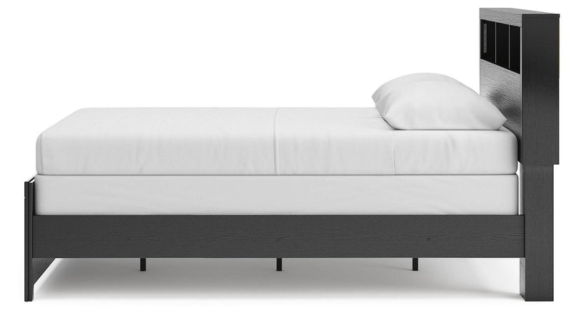 Ashley Furniture Broachmyn Bed with a close-up view of the side panel showcasing the wood finish and detailed design.