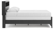 Ashley Furniture Broachmyn Bed with side view, showcasing its elegant frame and detailed headboard design.