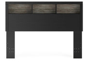 Ashley Furniture Broachmyn Bed with a headboard featuring a stylish design in a bedroom setting.