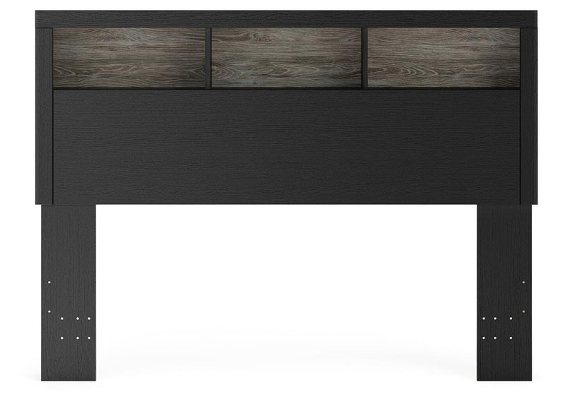 Ashley Furniture Broachmyn Bed with a headboard featuring a stylish design in a bedroom setting.
