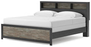 Ashley Furniture Broachmyn Bed with a contemporary design, featuring a wooden frame and upholstered headboard in a warm finish.