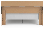 Ashley Furniture Broachmyn Bed with a dark wood finish and elegant headboard design, shown from the back view.