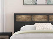 Ashley Furniture Broachmyn Bed with detailed headboard and dark wood finish, showcasing elegant bedroom furniture.