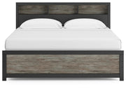 Ashley Furniture Broachmyn Bed with a stylish headboard in a modern bedroom setting.