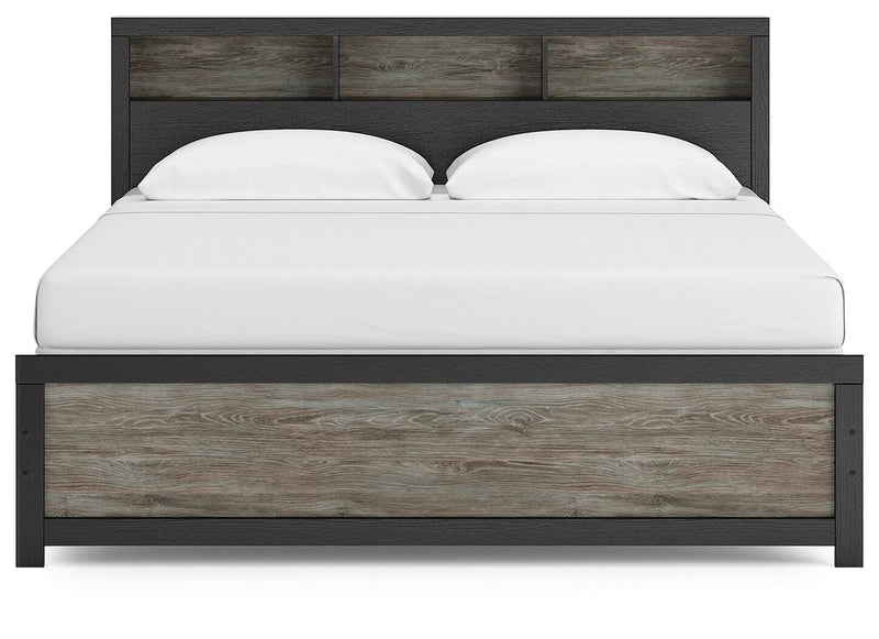 Ashley Furniture Broachmyn Bed with a stylish headboard in a modern bedroom setting.