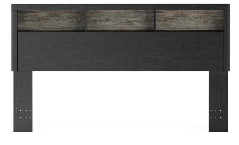 Ashley Furniture Broachmyn Bed with a headboard featuring a dark finish and elegant design, shown from a front angle.