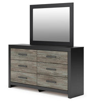 Ashley Furniture Broachmyn dresser and mirror set, showing a wooden dresser with a matching mirror in a modern bedroom setting.