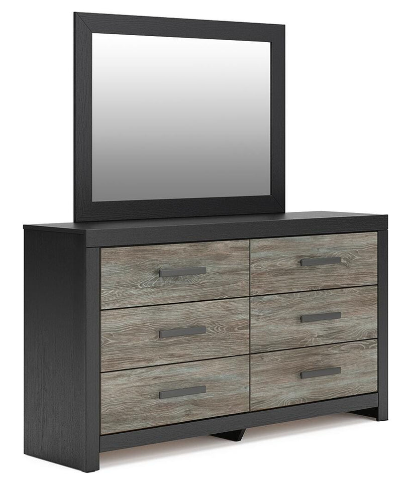 Ashley Furniture Broachmyn dresser and mirror set, featuring a wooden dresser with attached mirror in a modern bedroom style.