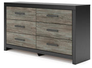 Ashley Furniture Broachmyn dresser and mirror set, showcasing a wooden dresser with a matching mirror in a modern bedroom setting.