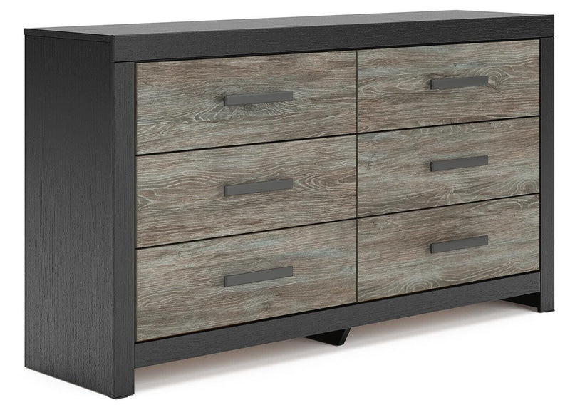 Ashley Furniture Broachmyn dresser and mirror set, featuring a stylish wooden dresser with an attached mirror, shown from an angled side view.
