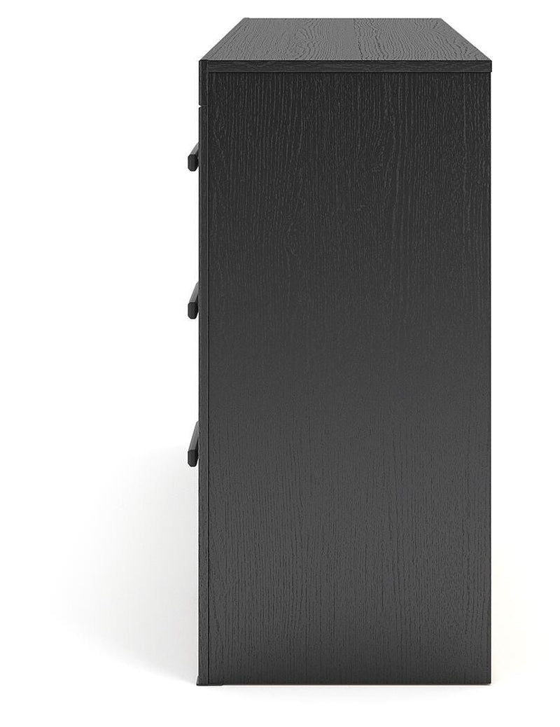 Ashley Furniture Broachmyn dresser with mirror, featuring a sleek wooden design and spacious drawers, shown from the side.